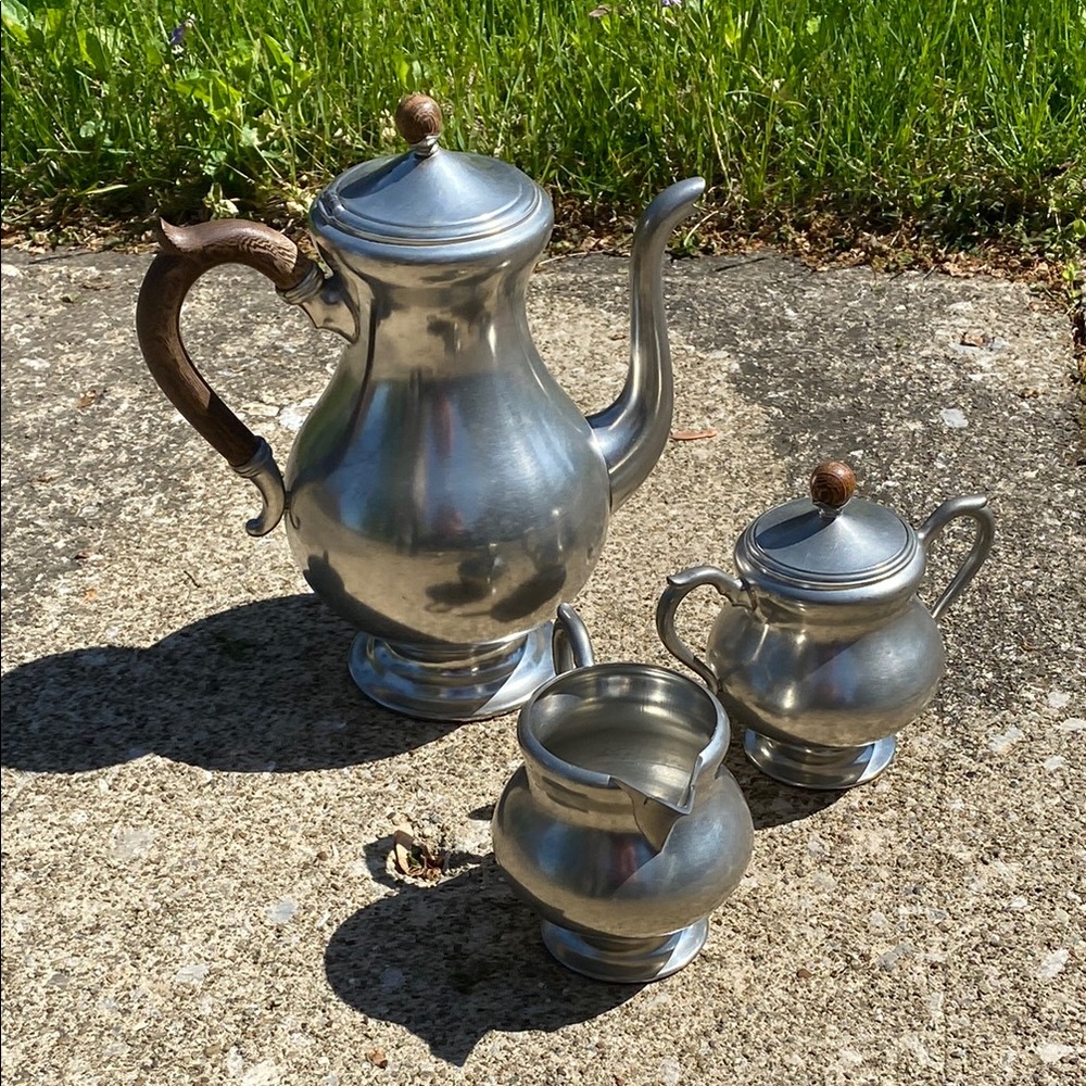 Elegant Silver Tea Set with Wooden Accents